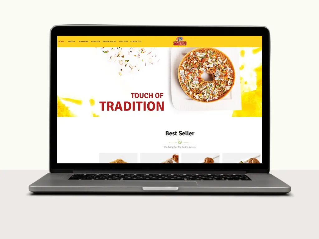 Laptop displaying a sweets website featuring a colorful donut topped with nuts, highlighting tradition and best sellers.