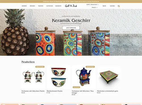 Website screenshot showing colorful ceramic containers with lids and a pineapple on a counter, featuring a product catalog below.