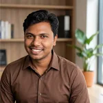 Portrait of Sanjay Bhati in a brown shirt and he is the owner of Burger Mart.