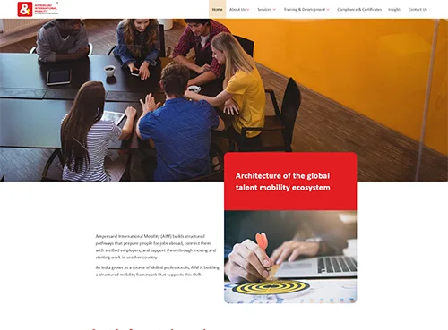 A group of people collaborating at a table with laptops, illustrating teamwork in the global talent mobility ecosystem.